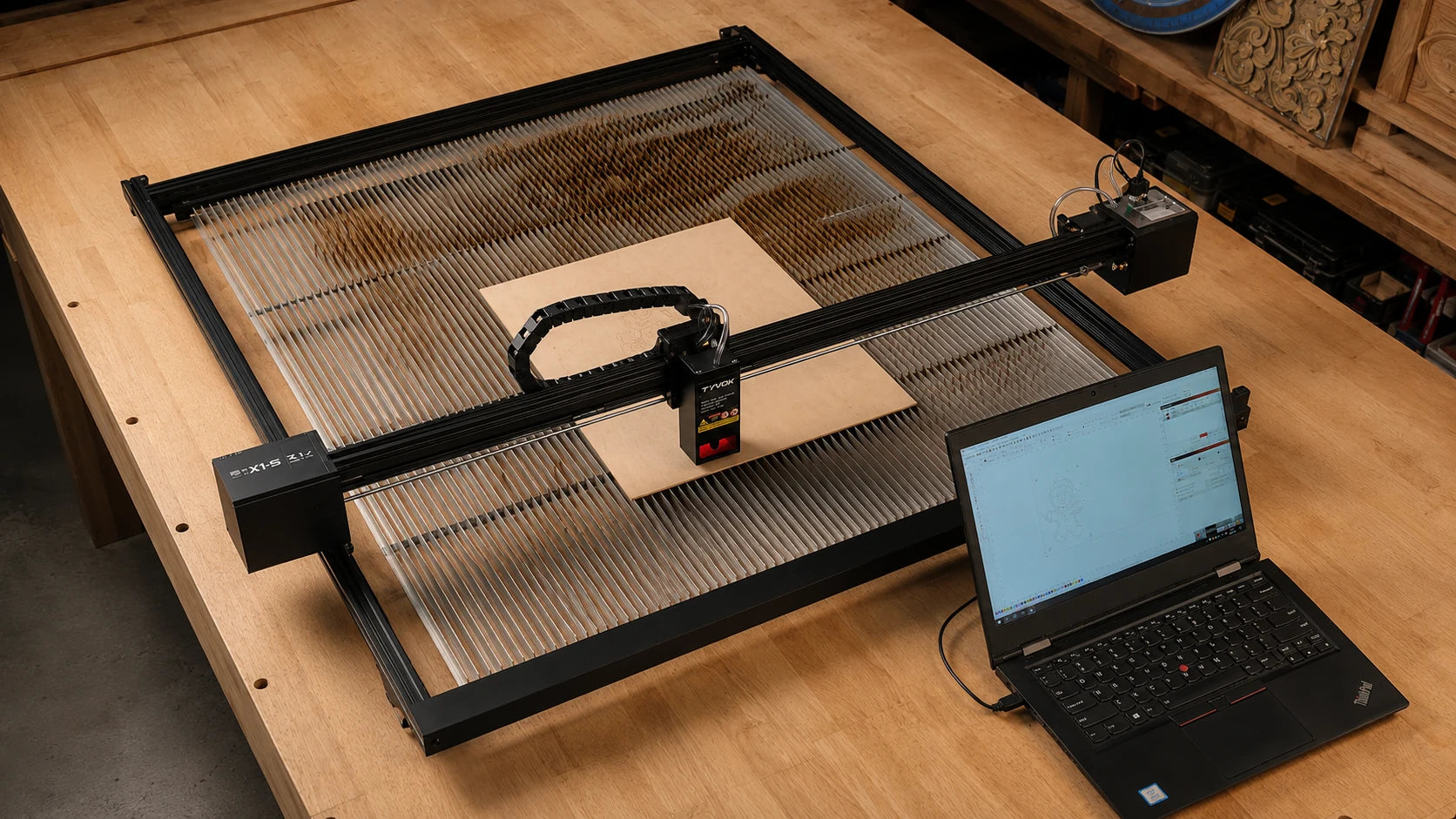 Real TYVOK X1S 2026 800 x 800 mm workspace with laptop and honeycomb working bed